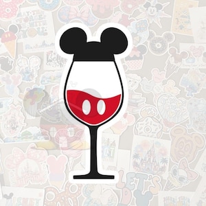 May include: A sticker featuring a wine glass with a Mickey Mouse-inspired design. The top of the glass is black with two rounded ears, the glass is white with a red wine-like liquid and two white circles, and the stem is black.