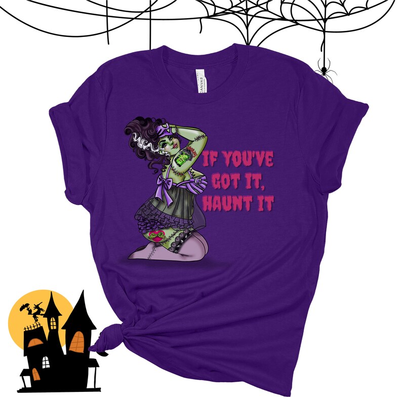May include: Purple t-shirt with a green zombie woman wearing a black and purple lingerie outfit. The text "If you've got it, haunt it" is printed on the shirt.