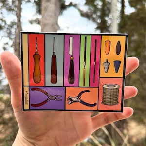 May include: A sticker with a colorful grid of tools for jewelry making. The tools include a drill, a file, a knife, pliers, and a spool of wire.