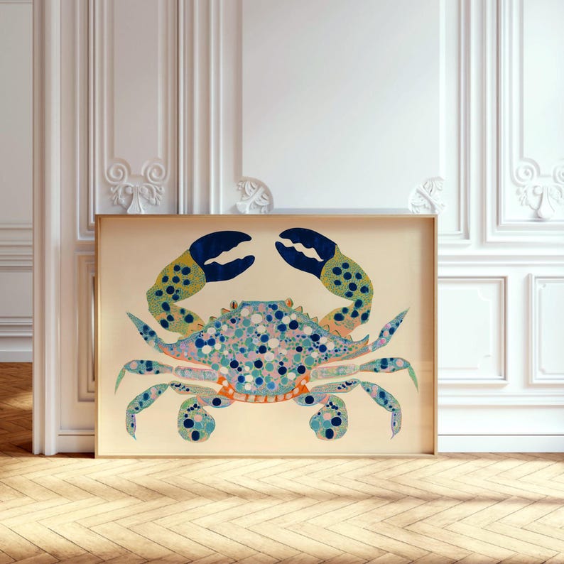 May include: A colorful illustration of a blue crab with yellow and green accents on a cream background. The crab is depicted in a detailed, stylized manner with a variety of blue, green, yellow, and pink dots and circles.