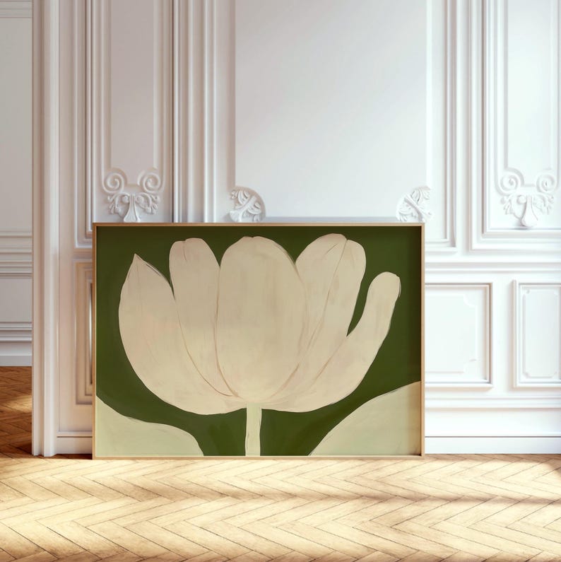 Peut inclure: Une peinture abstraite encadr&eacute;e d'une grande fleur blanche sur fond vert. La fleur est stylis&eacute;e et pr&eacute;sente un design simple et moderne.