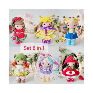 May include: Set of six crocheted dolls, each with a different outfit and hairstyle. The dolls are dressed in a variety of colors, including pink, yellow, blue, green, and red. The dolls are all wearing different accessories, such as hats, bows, and shoes. The dolls are all standing on a white background. Set 6 in 1.