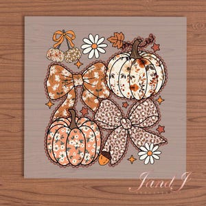 May include: A fall-themed design featuring pumpkins, bows, and floral accents. The pumpkins are in shades of orange and white, adorned with floral patterns. Two bows have a floral pattern, and one has a leopard print. The design includes stars, daisies, and a cherry.
