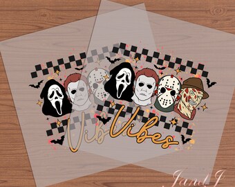 May include: A clear transfer sheet with a design featuring a checkered pattern, bats, and five horror movie character masks. The masks are of Michael Myers, Jason Voorhees, Freddy Krueger, Ghostface, and Leatherface. The text "Vib Vibes" is written in orange below the masks.