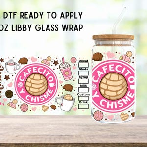 May include: A 16 ounce glass tumbler with a pink and white design featuring the text "Cafecito y Chisme" and a cartoon image of a sweet bread. The tumbler has a wooden lid and a clear straw.