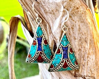 Nepalese Tibetan earrings with coral stones and hand-decorated silver. Ethnic boho jewelry