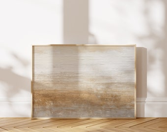 May include: A framed abstract painting with a textured, layered look. The painting features shades of brown, beige, and white, creating a subtle and calming effect. The frame is a simple, gold-toned metal.