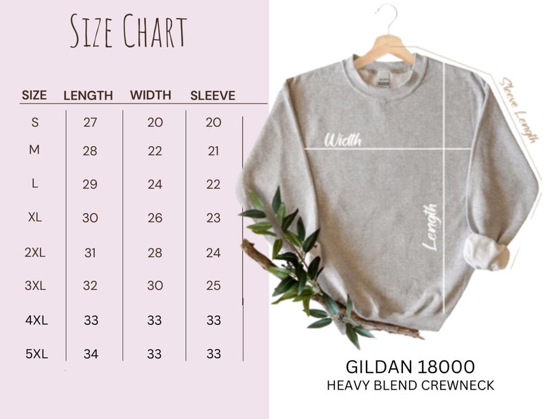 Pode incluir: Uma camisola cinza claro Gildan 18000 Heavy Blend com gola redonda est&aacute; pendurada num cabide de madeira. Uma tabela de tamanhos mostra as medidas em cent&iacute;metros de comprimento, largura e comprimento da manga para os tamanhos S a 5XL.