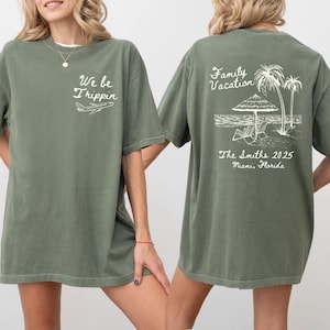 May include: Two green t-shirts with white text and graphics. The front shirt says "We be Trippin'" with a plane. The back shirt says "Family Vacation" with palm trees, an umbrella, and lounge chairs. The text below the graphic says "The Smiths 2025 Miami, Florida."