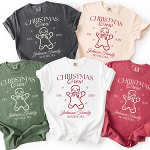 May include: Five t-shirts in various colors, including charcoal, cream, white, green, and red. Each shirt features the text "CHRISTMAS Crew" above a gingerbread man graphic, with "EST. 2025" and "Johnson Family, Seattle, WA" below.