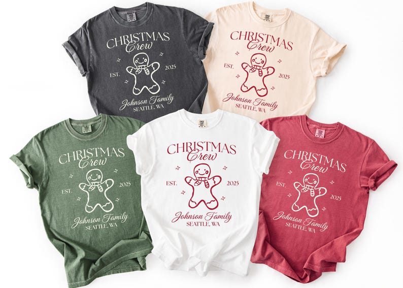 May include: Five t-shirts in various colors, including charcoal, cream, white, green, and red. Each shirt features the text "CHRISTMAS Crew" above a gingerbread man graphic, with "EST. 2025" and "Johnson Family, Seattle, WA" below.