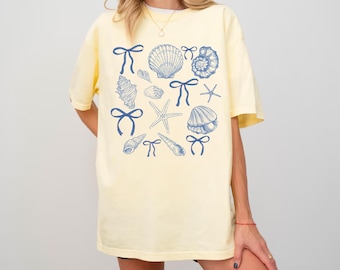 Maglietta Coquette Seashell Vestiti estetici costieri Maglietta estiva da spiaggia per ragazze Maglietta retrò con natura oceanica Maglietta con vita marina Regalo per gli amanti delle conchiglie