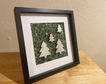 Christmas Tree Collage. Silver painted wooded trees on Green and Gold Fabric Background