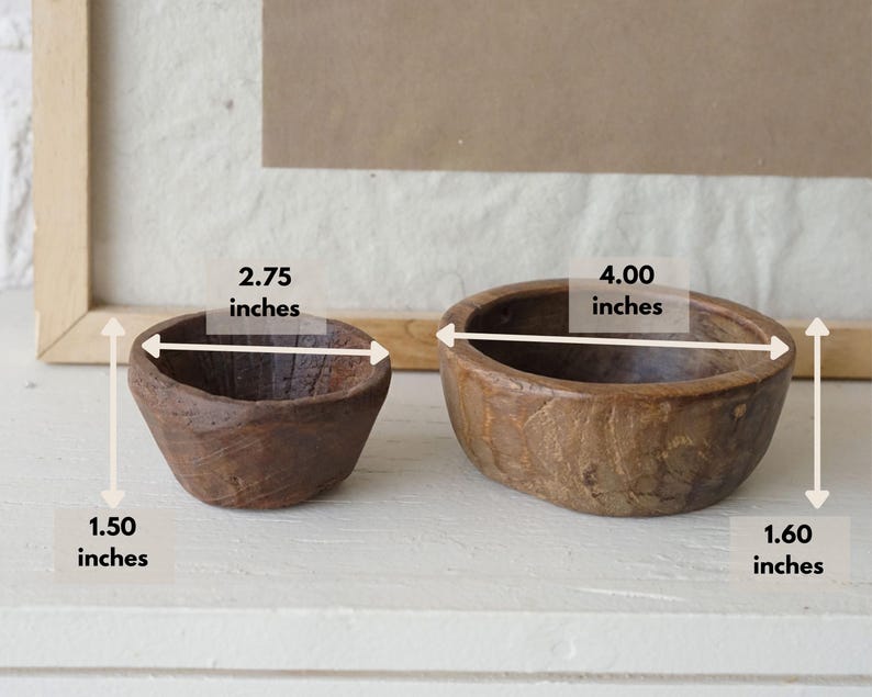 May include: Two small, rustic wooden bowls. The smaller bowl is 2.75 inches wide and 1.50 inches tall. The larger bowl is 4.00 inches wide and 1.60 inches tall. Both bowls have a natural wood grain finish and are set against a neutral background.