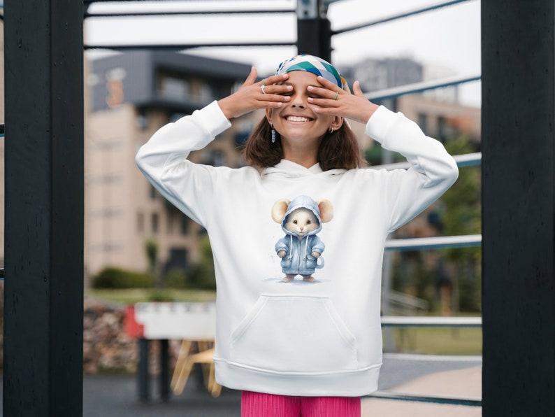 May include: White hoodie with a blue hooded mouse graphic. The hoodie has a kangaroo pocket and a drawstring hood.