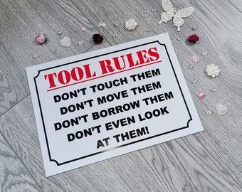 Funny sign - Tool rules, don't touch them, don't look at them. Workplace, mechanic, factory worker, road worker, electrician, tradesman