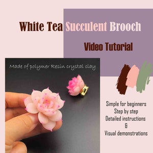 May include: A pink and white succulent brooch made of polymer resin crystal clay. The brooch is shown being held by a hand. The image includes the text "White Tea Succulent Brooch Video Tutorial Made of polymer Resin crystal clay Simple for beginners Step by step Detailed instructions & Visual demonstrations"