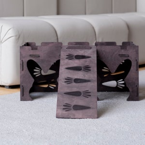 May include: A dark brown wooden pet house with a bunny ear design and a ramp featuring carrot engravings. The house has cut-out bunny ear shapes and a ramp with five carrot illustrations. The structure is placed on a light-colored carpet.
