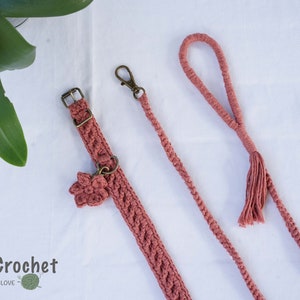 May include: A set of pink crocheted dog collar and leash with a flower charm on the collar. The leash has a tassel at the end. The text "MokaCrochet - HANDMADE WITH LOVE" is visible in the bottom left corner of the image.