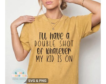 May include: A mustard yellow short-sleeved t-shirt with a crew neckline. The front of the shirt features black text that reads, I'll have a DOUBLE SHOT Of whatever MY KID IS ON. The fabric has a slightly faded, vintage-inspired texture.