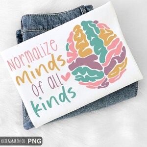 May include: A set of three ceramic mugs with a speckled, matte finish. The mugs are in shades of cream, light gray, and dark gray. Each mug has a simple, minimalist design and a rounded handle.