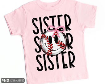 May include: A light pink t-shirt with the word "SISTER" in black, distressed font. A baseball with a smiley face and a pink bow is in the center. The baseball has red stitching. The shirt is a youth size.