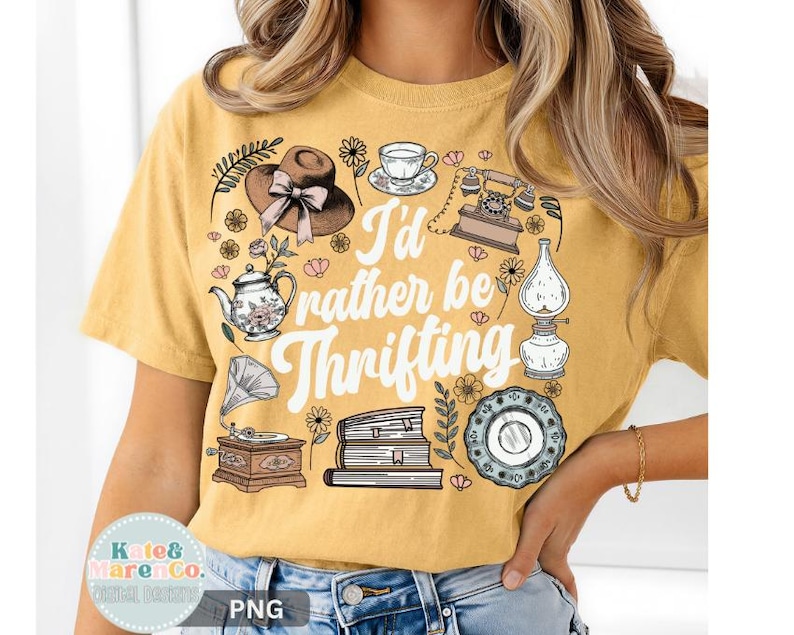 May include: Mustard yellow t-shirt with the phrase "I'd rather be thrifting" and vintage-style illustrations of a hat, teapot, teacup, telephone, lamp, plate, books, and a gramophone.