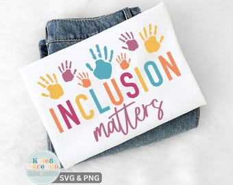 May include: White t-shirt with the words "INCLUSION matters" in colorful letters and handprint graphics. The shirt is folded on top of a pair of blue jeans. The design includes the text "Kate & Marenco. Digital Designs" and "SVG & PNG".