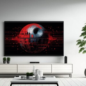 May include: A black framed television with a red and gray Death Star graphic on the screen. The television is sitting on a white entertainment center with a white coffee table in front of it. A potted green plant is on the right side of the image.