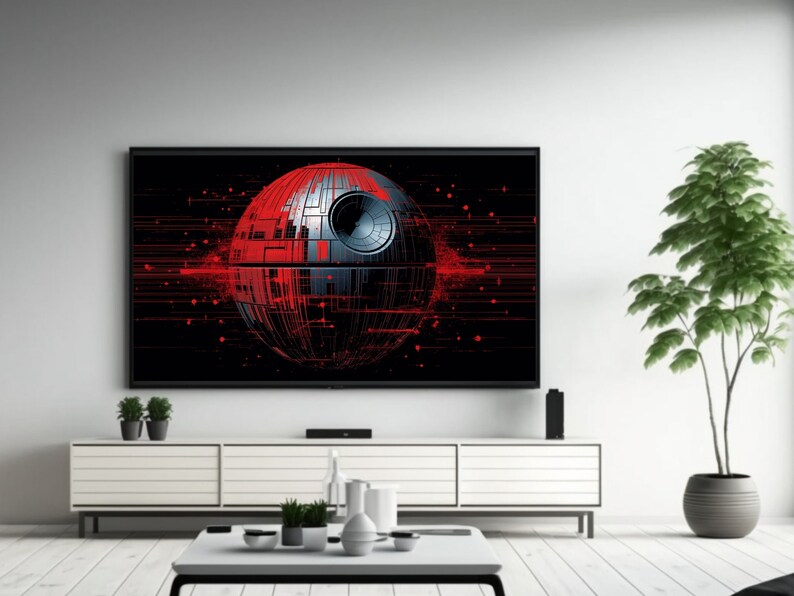 May include: A black framed television with a red and gray Death Star graphic on the screen. The television is sitting on a white entertainment center with a white coffee table in front of it. A potted green plant is on the right side of the image.