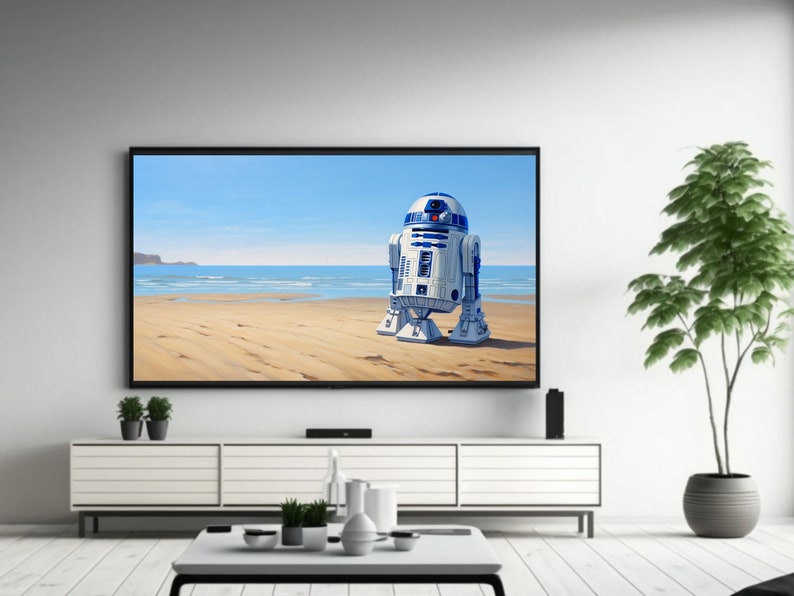 May include: A white and blue robot character stands on a sandy beach with blue water and a cloudy sky in the background. The robot is on a flat screen television that is mounted on a white wall above a white entertainment center.