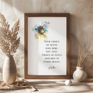 May include: A framed print with a watercolour bee illustration in yellow, blue, and purple. The print displays the text: "YOUR CHOICE OF QUOTE GOES HERE. ANY TEXT. CHOICE OF FONTS AVAILABLE IN OTHER IMAGES."