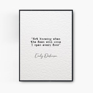 May include: Black and white typography print with a quote by Emily Dickinson: "Not Knowing when the dawn will come I open every door".