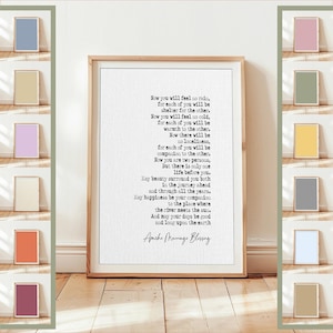May include: A framed print with a light wood frame displays the text of the Apache Marriage Blessing in black font on a white background. The print is displayed on a light wood floor.