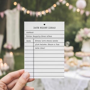 Puede incluir: Una tarjeta blanca con el texto "DATE NIGHT IDEAS" y el título "Happily Ever After". La tarjeta incluye líneas para escribir y el texto "Every love story needs plot twists. Share a fun date idea!"