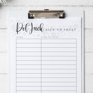 May include: A white clipboard holding a sign-up sheet. The sheet features a snowflake pattern and the text "Potluck Sign Up Sheet." Spaces are provided for names and dishes. A silver clip secures the sheet.