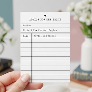 May include: A white card with the text "ADVICE FOR THE BRIDE" and a heart symbol at the top. The card has lines for "Author", "Title: A New Chapter Begins", and "Date" with a section for "Advice and Wishes".
