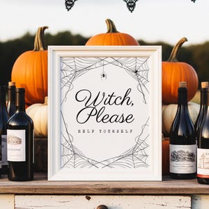 May include: A framed sign with the text "Witch, Please, Help Yourself" surrounded by a spiderweb design. The sign is displayed with pumpkins and wine bottles, creating a Halloween theme.