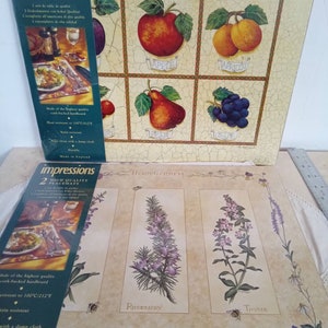 May include: Set of two high-quality cork-backed placemats featuring a fruit and herb garden theme. The placemats are heat-resistant up to 212 degrees Fahrenheit and are made in England.