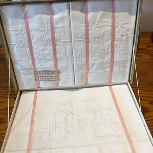 New Vintage Irish Linen pillowcase and bolster set new in box lovely embroidery design on white linen. Two pillowcases and one bolster case