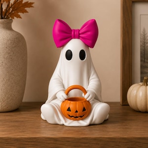 Printable Halloween ghost figurines with smooth flowing details and festive pumpkin buckets.