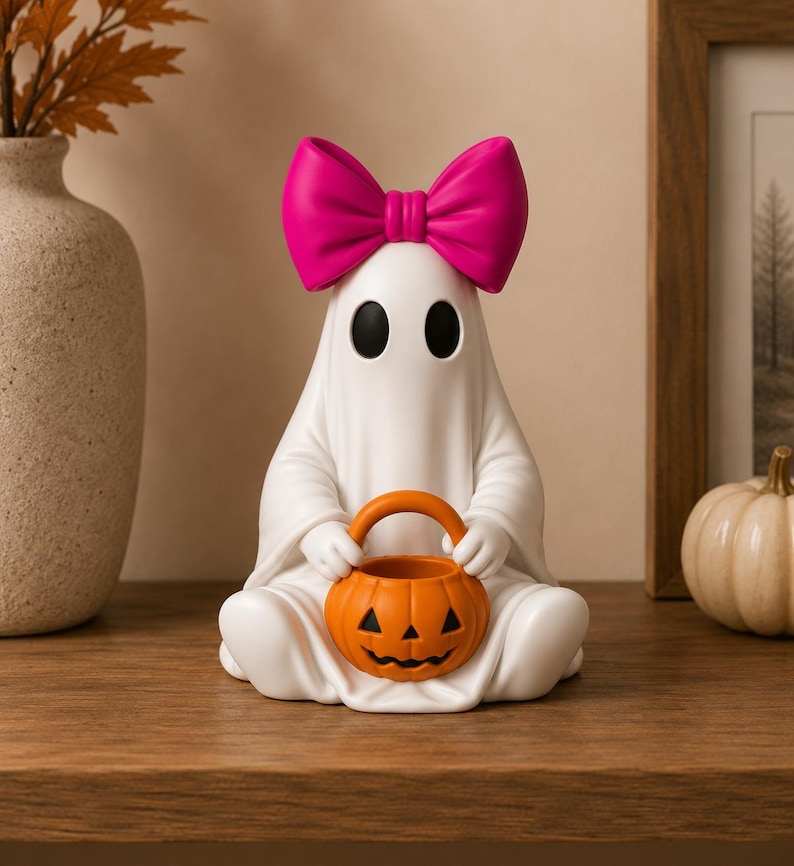 Printable Halloween ghost figurines with smooth flowing details and festive pumpkin buckets.