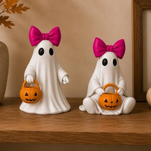 Adorable ghost figurines with jack-o'-lantern buckets designed for easy FDM and resin 3D printing.