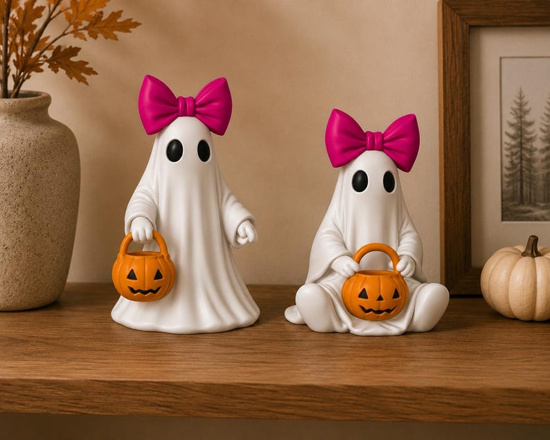 Adorable ghost figurines with jack-o'-lantern buckets designed for easy FDM and resin 3D printing.