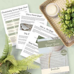 May include: A crochet gauge guide with four pages, featuring a close-up of a crochet hook and yarn. The guide includes information on troubleshooting common gauge issues, what crochet gauge is, why gauge is important, and how to create gauge swatches.