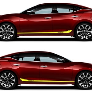 May include: A red saloon car with yellow side stripes. The car has black wheels and a black interior. The car is on a white background.