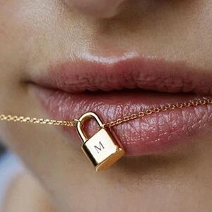 LV lock necklace – _lottieandlucy_