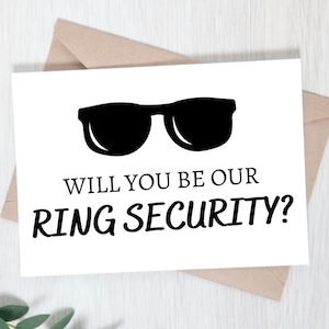 May include: A white card with black text and a black silhouette of sunglasses. The text reads "Will you be our ring security?"