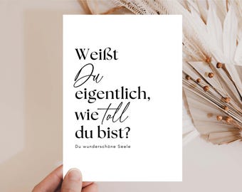 May include: A white card with black text that reads "Weist du eigentlich, wie toll du bist? Du wunderschöne Seele".