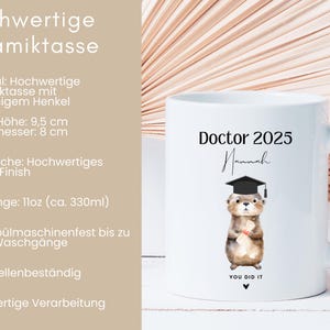 May include: White ceramic mug with a graduation cap otter illustration and the text "Doctor 2025 Hannah You Did It". The mug is 9.5 cm tall and 8 cm in diameter.